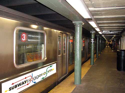 SUBWAYblogger advertisement on side of train.